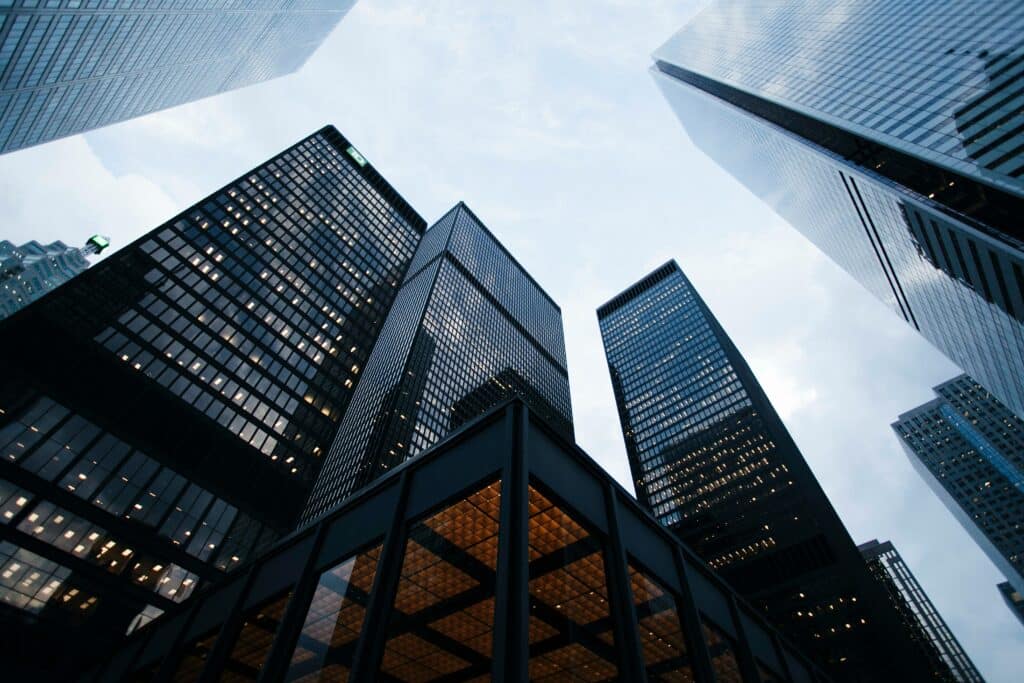 low angle photo of high rise city buildings during day time